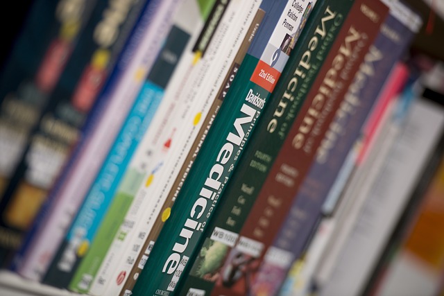 Photo shows spines of medical books on a bookshelf