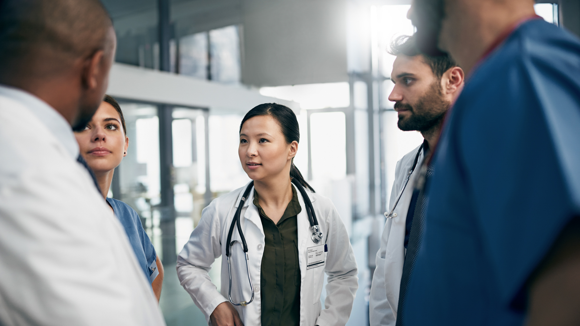 medical staff chatting in a hallway