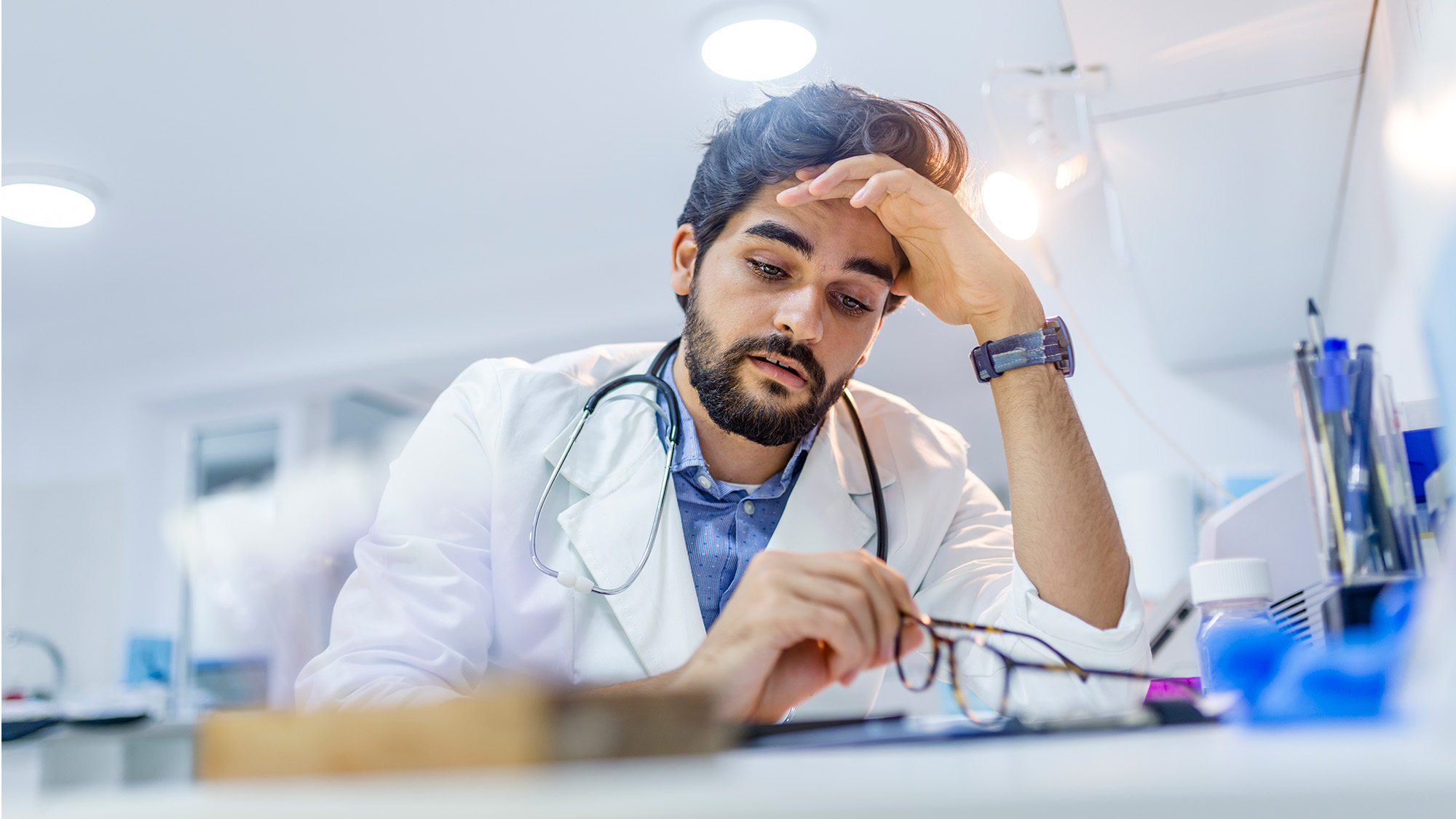 tired physician at desk