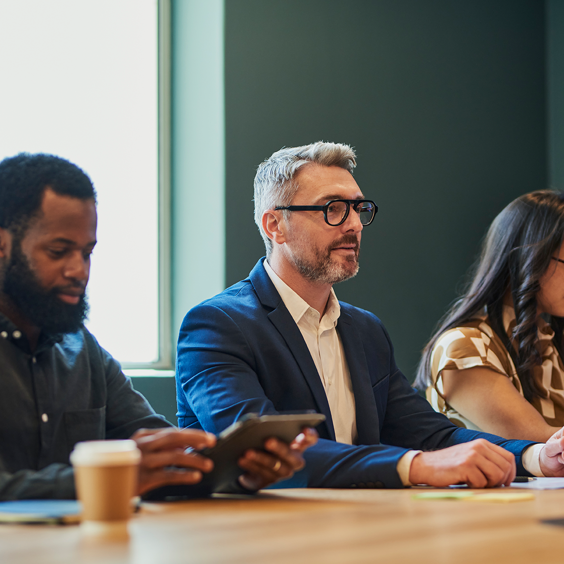 a group of people in a meeting